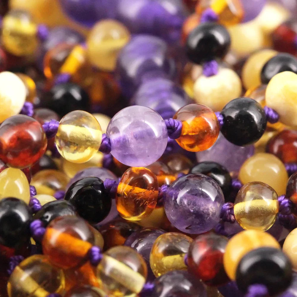 baltic amber and amethyst necklaces close up