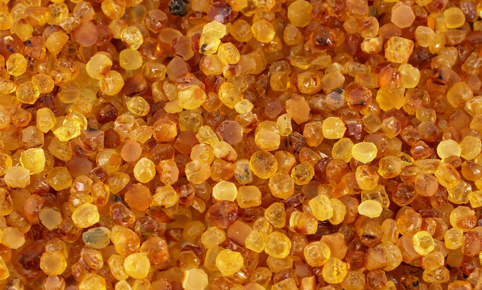 close-up-rough-amber-beads-raw-material-honey